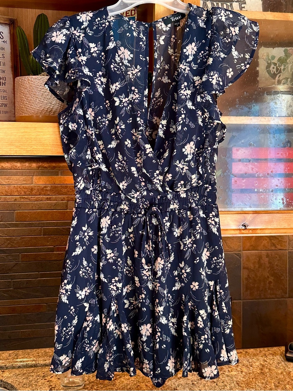 Francesca's Navy Floral Ruffle Romper